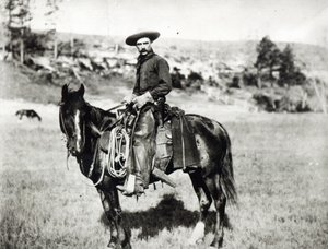 Cow-boy montant un cheval au Montana, USA, vers 1880